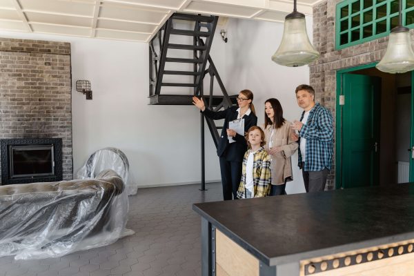 A family viewing a property to be bought on mortgage.
Photo Credit: Mart Production